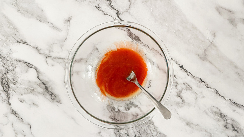 buffalo sauce in clear bowl