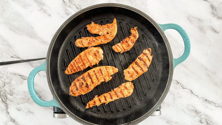 chicken cooking on grill pan