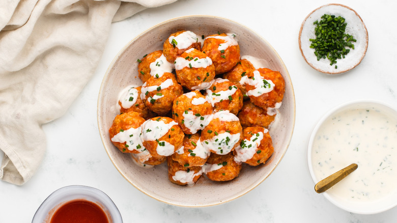 Bowl of buffalo chicken meatballs with ranch sauce