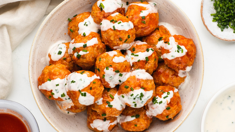 Bowl of buffalo chicken meatballs with ranch sauce