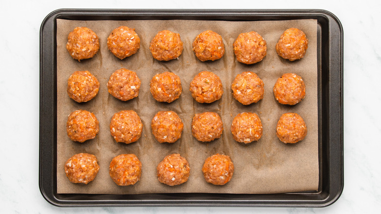 Buffalo chicken meatballs on baking sheet