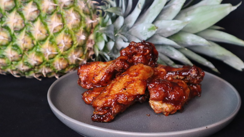 chicken wings in front of pineapple