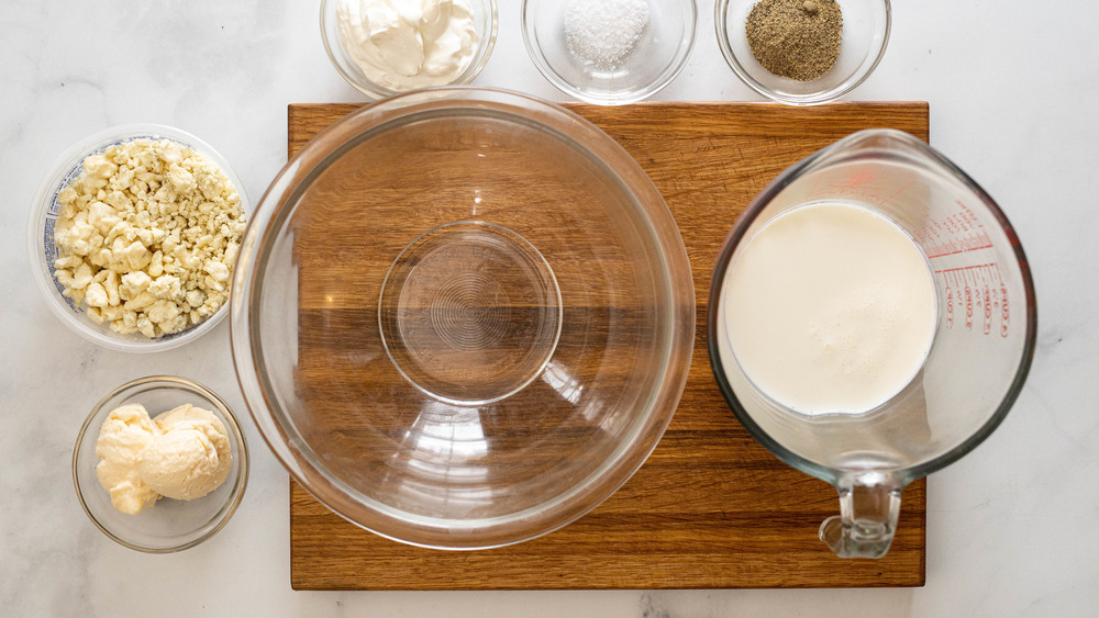 blue cheese dressing ingredients on wooden cutting board