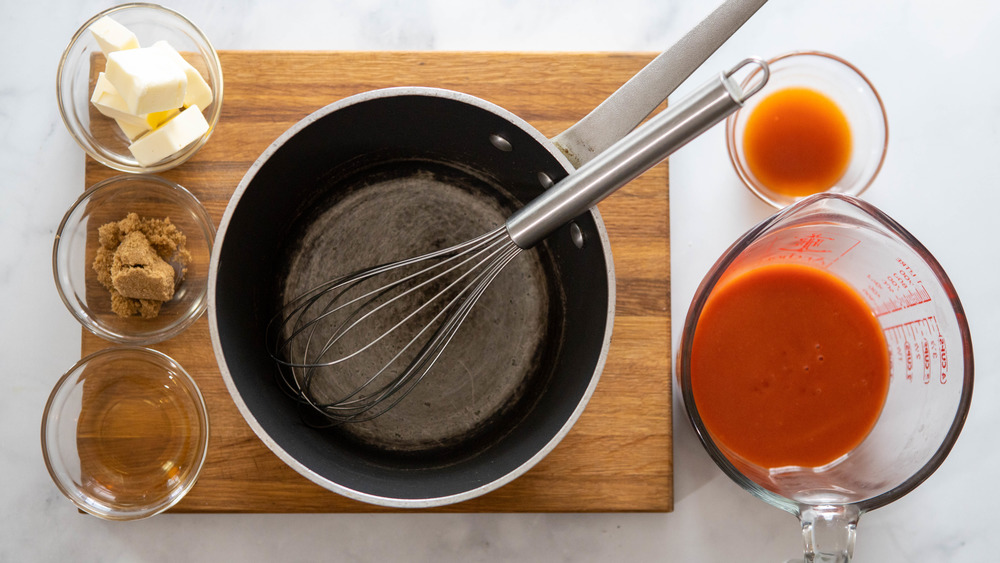 buffalo sauce ingredient on wooden cutting board