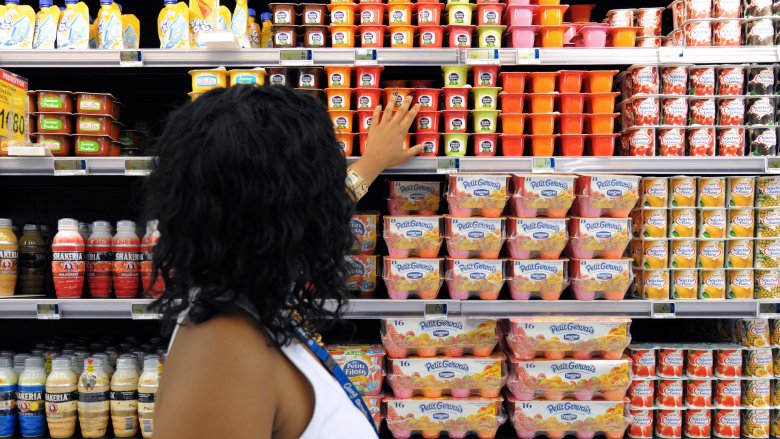 person buying yogurt