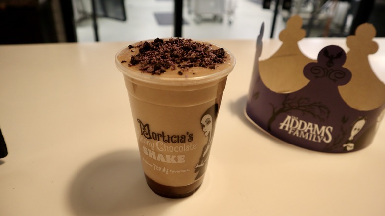 chocolate milkshake with crown in background