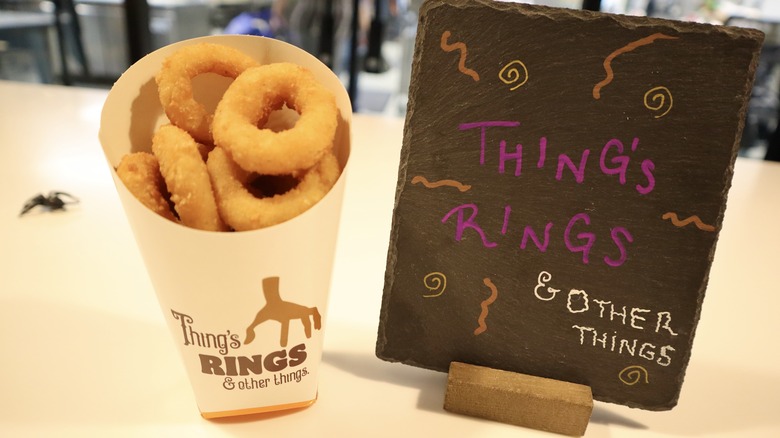 onion rings next to sign reading Thing's Rings and Other Things