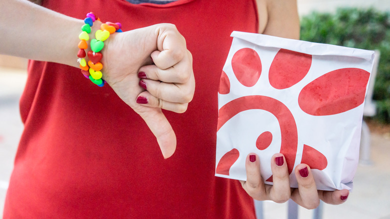 Thumbs down with Chick-fil-A bag