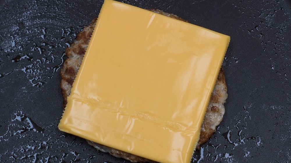 cooking sausage with American cheese