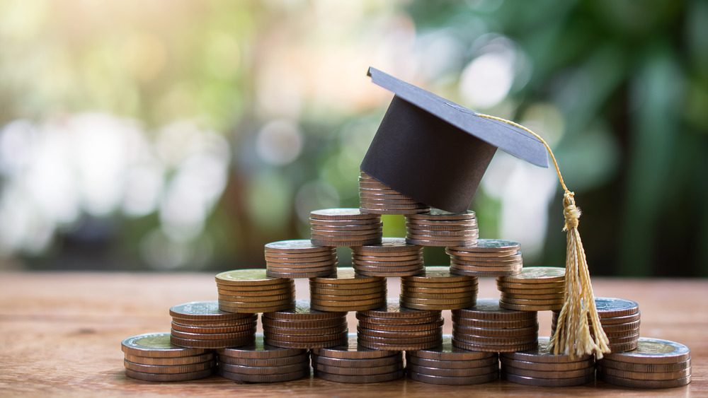 Mortarboard upon coins