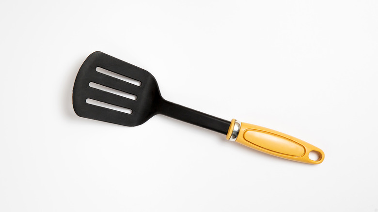 black spatula on white background