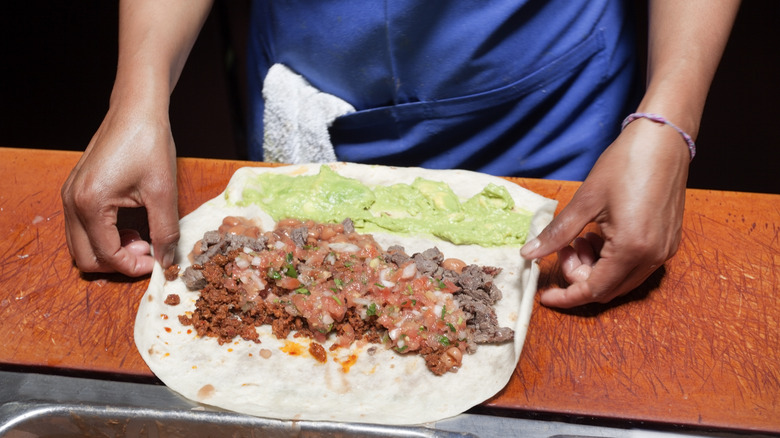 chef preparing burrito