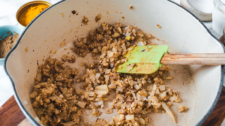 onions sautéing in dutch oven pan