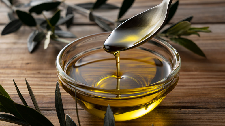 spoon and bowl of olive oil