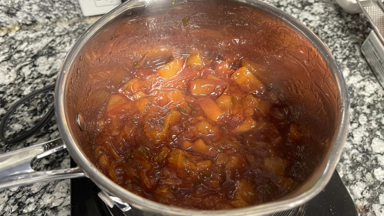 Peach jalapeno jam in saucepan