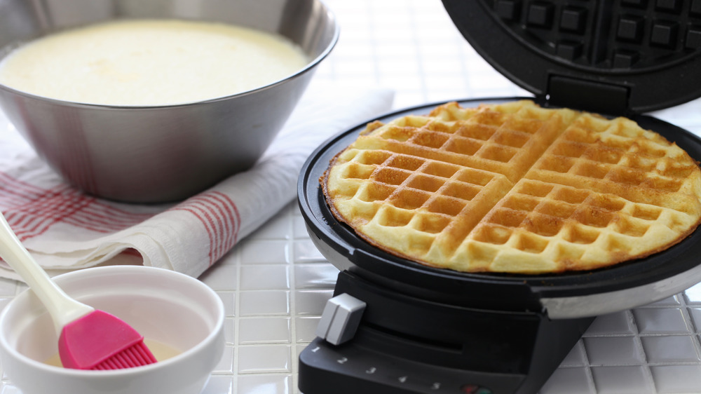 making waffles in a waffle iron