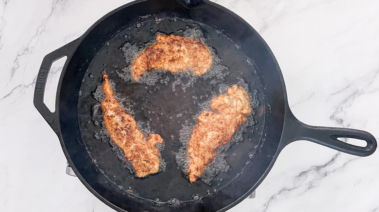 chicken tenderloins in frying pan