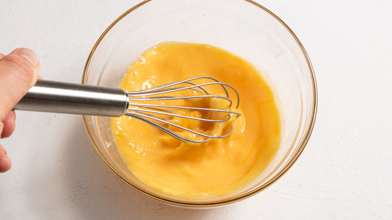 Whisking eggs in a bowl