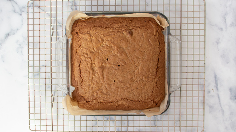 baked blondies in baking dish on cooling rack