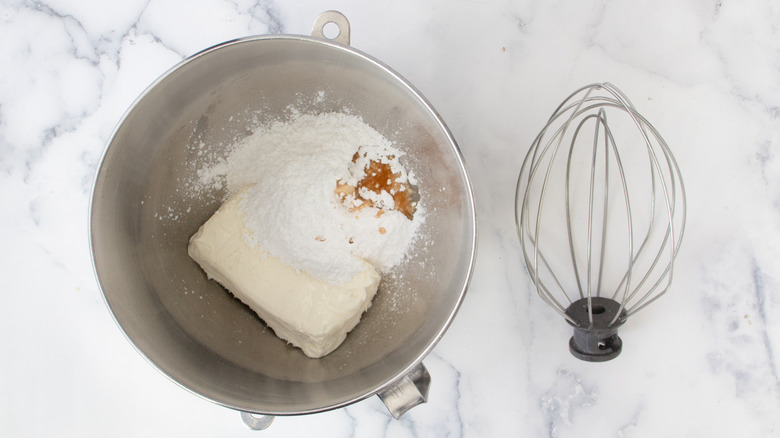 cream cheese frosting ingredients in bowl