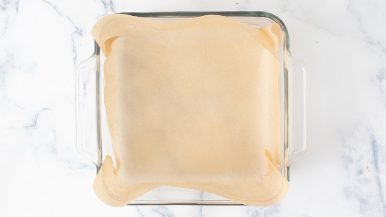 square glass baking dish with parchment paper