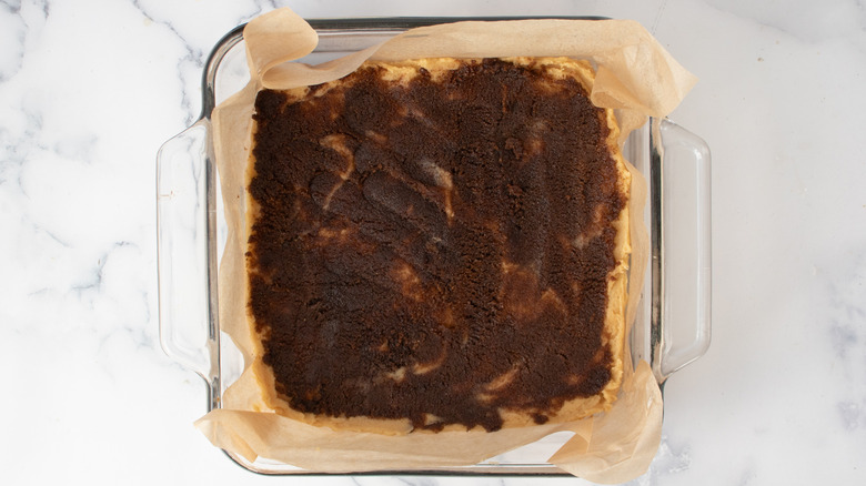 blondie batter topped with cinnamon sugar in baking dish