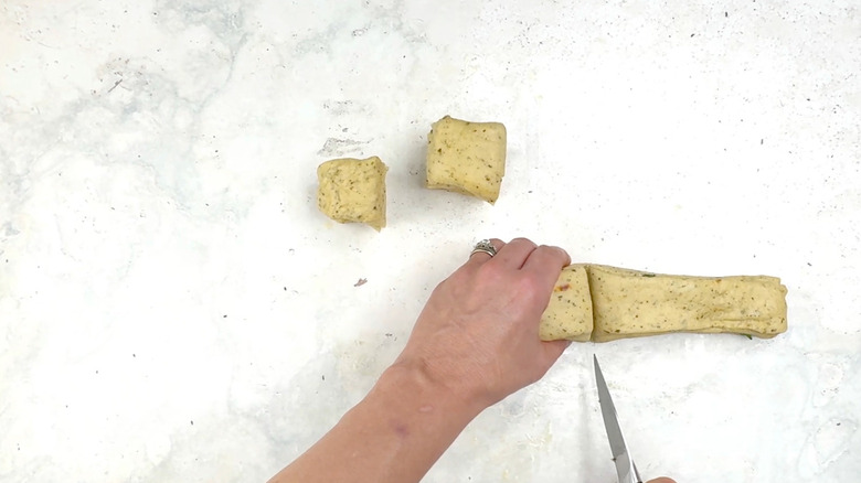 cutting stacked dough