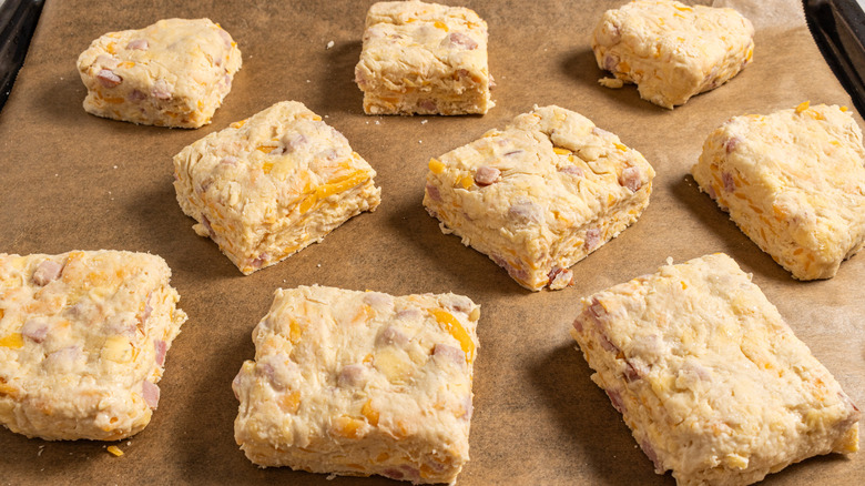 Raw biscuits on a baking tray