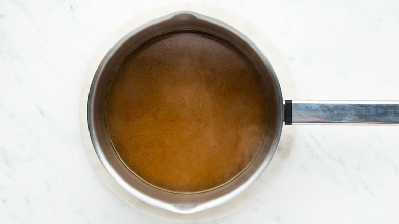 Vegetable stock in saucepan