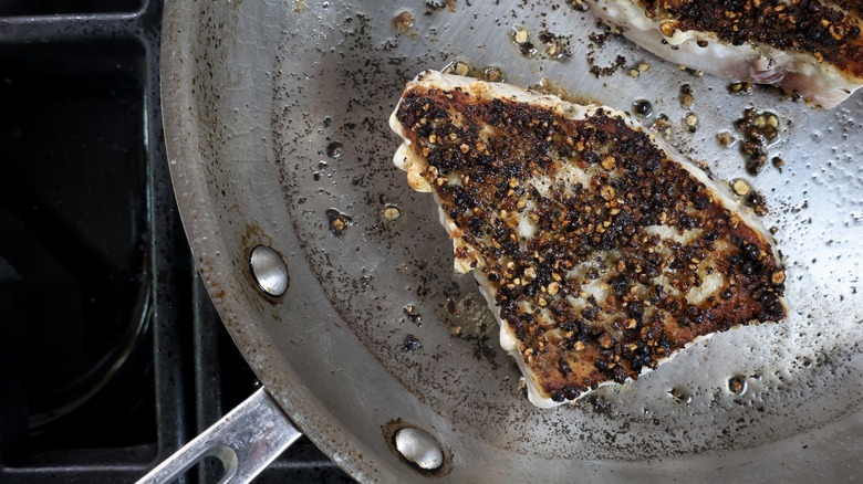 swordfish au poivre in skillet