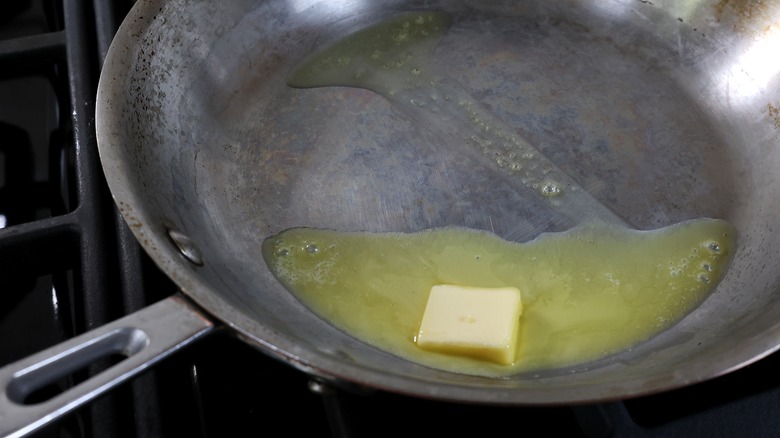 butter melting in skillet