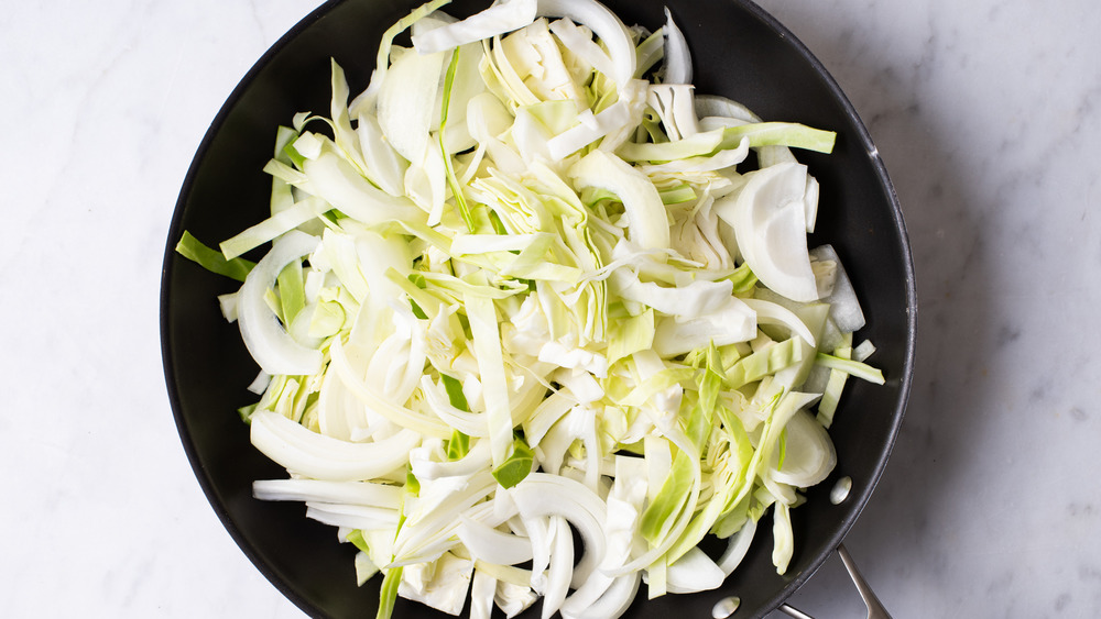 raw sliced cabbage on skillet