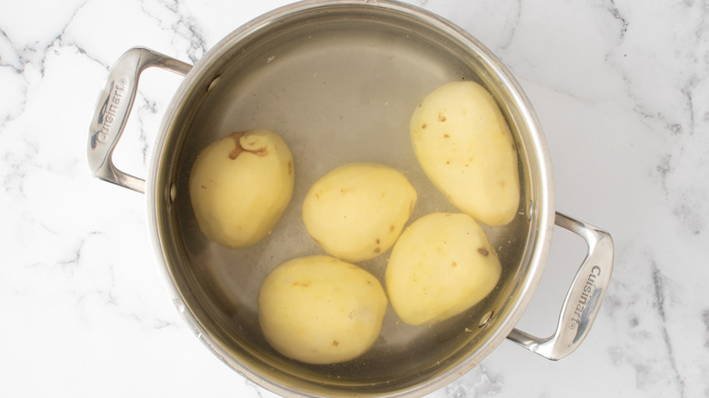 potatoes in pot with water