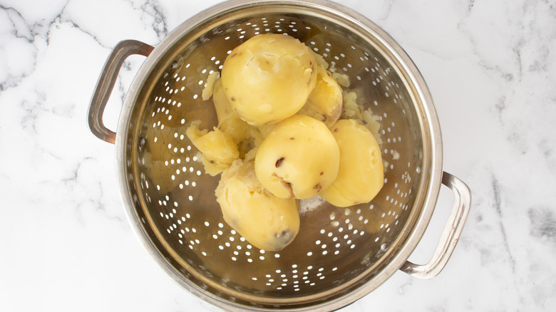 draining cooked potatoes in colander