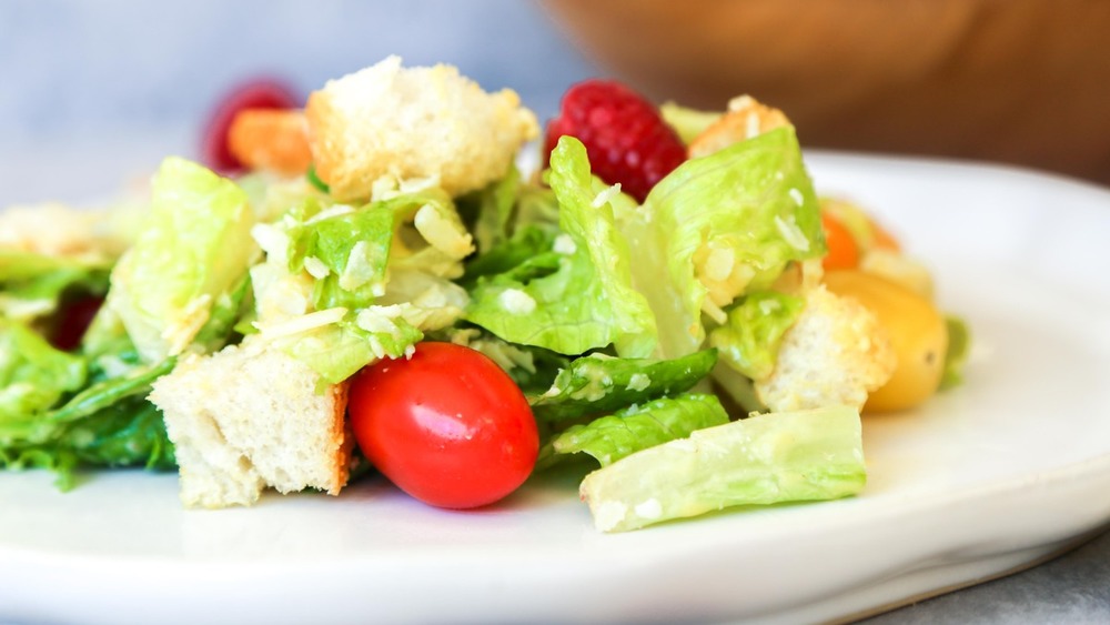 Caesar salad finished in bowl