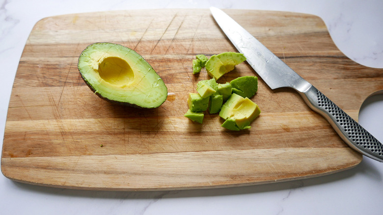 Sliced avocado on cutting board