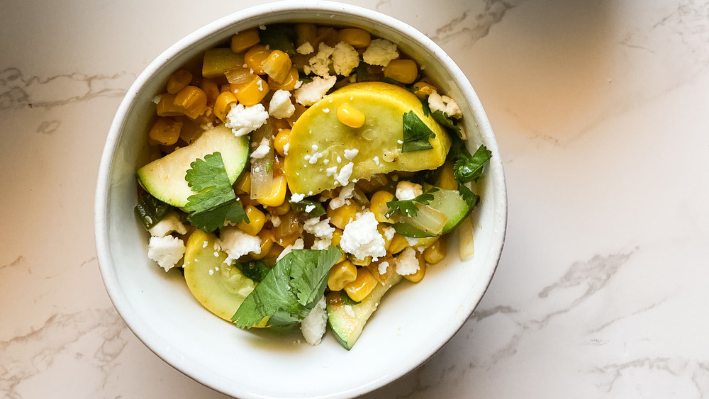 calabacitas topped with queso fresco