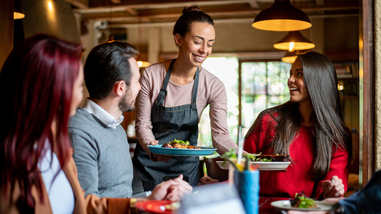 person waiting tables at a restaurant