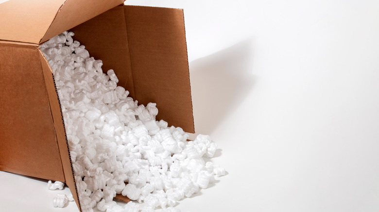 Packing peanuts falling out of a cardboard box