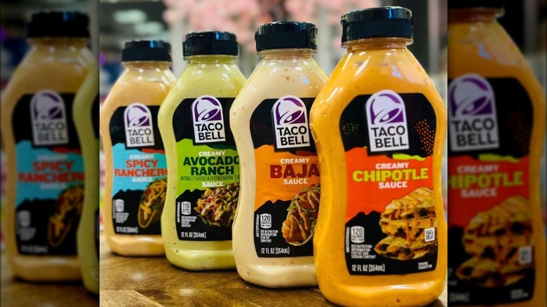 An assortment of bottled Taco Bell sauces