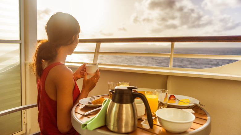 Person with food on a cruise balcony