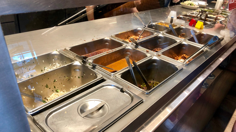 Chipotle ingredients behind order counter