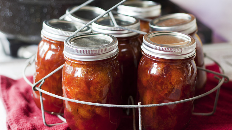 Homemade jam on canning rack