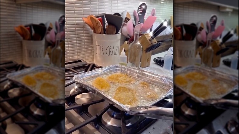 frying chicken in aluminum pan