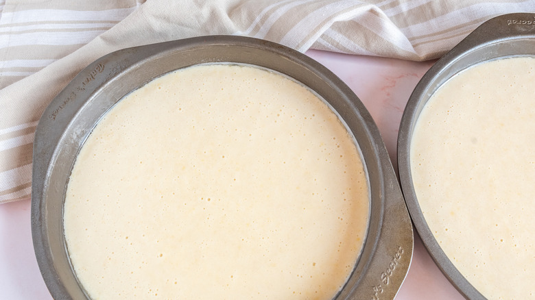 cake batter in cake pans