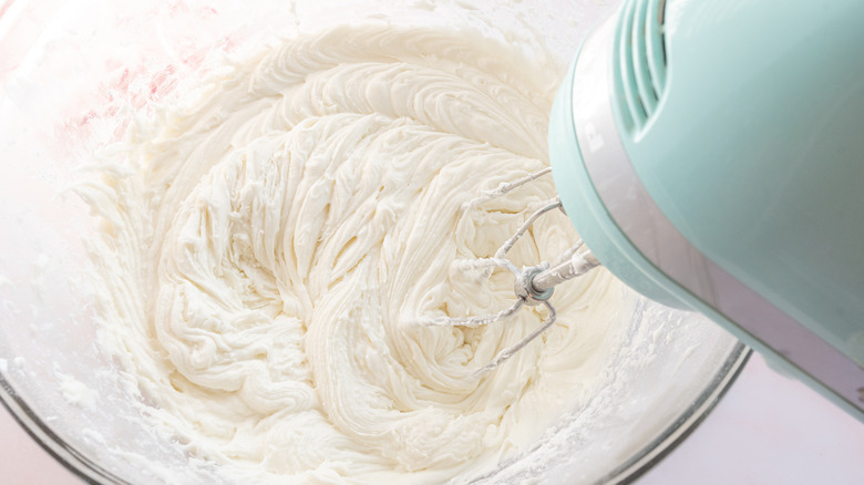 mixing peppermint frosting