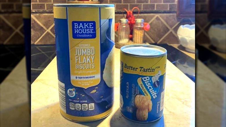 A can of Aldi biscuits beside the competitor's biscuits pillsbury