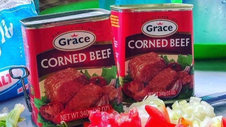 Two cans of Grace Corned Beef with chopped vegetables