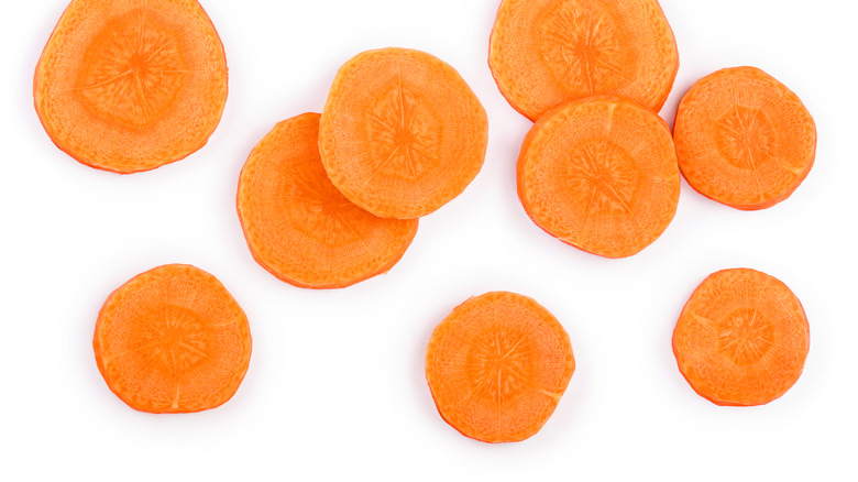 Sliced carrots on white background