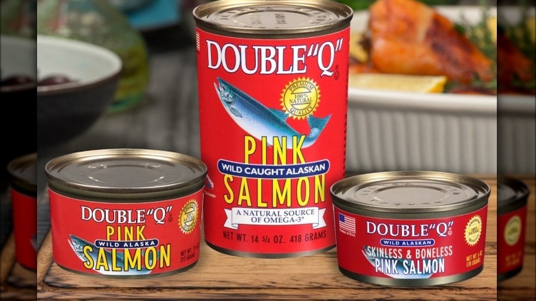 three cans of Double Q Salmon